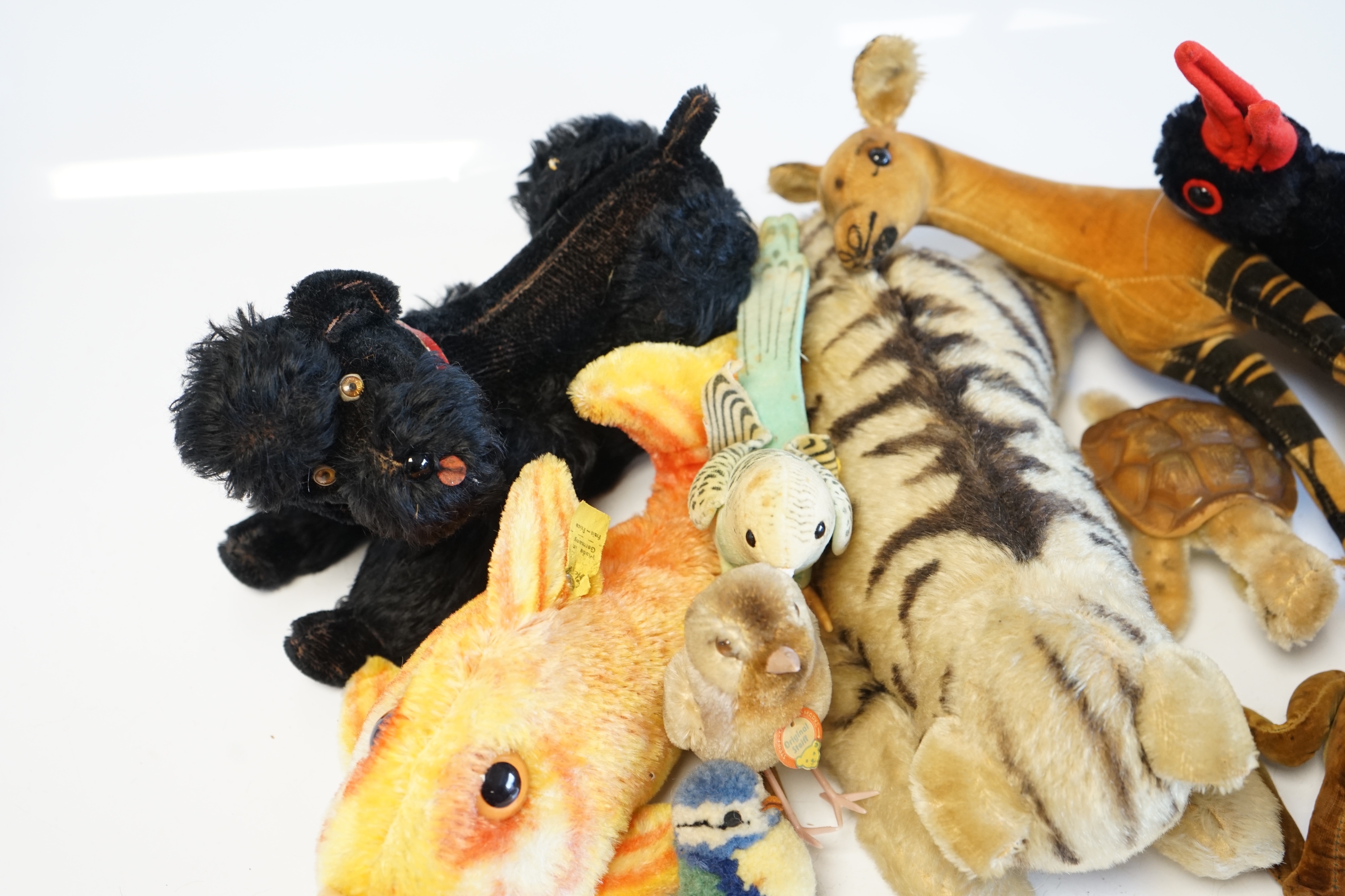 Eleven assorted 1960's Steiff toys, including Knobby the poodle, a large goldfish and various birds. Condition - fair